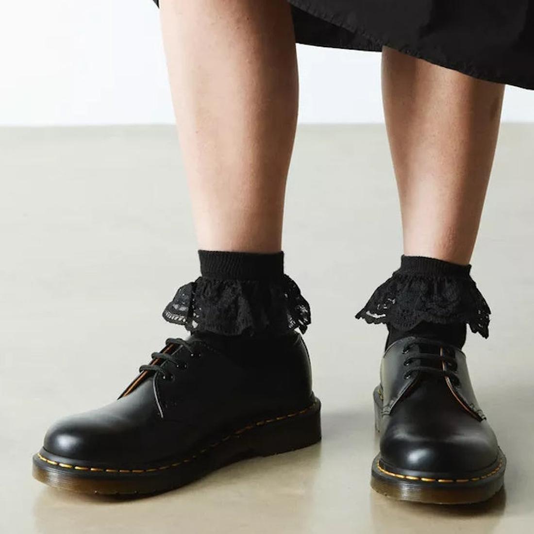 A cozy scene: Dr Martens Ankle Frill Cotton Blend Socks in black, paired with sturdy black lace-up shoes and non-slip soles.  ksnz, 190665640809, 190665640793