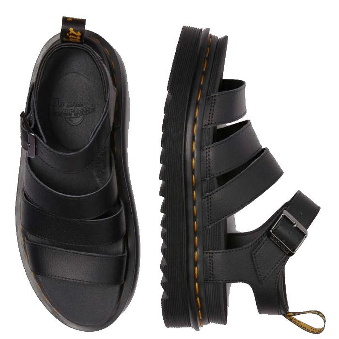 A pair or Dr Martens Blaire 3 strap sandlas on a white background. the left foot laying down showing the outer side of the sandal. The right foot top down shoung the black inner sole foot bed and jusr seeing the dr martens logo stamped on the heel. ,19066