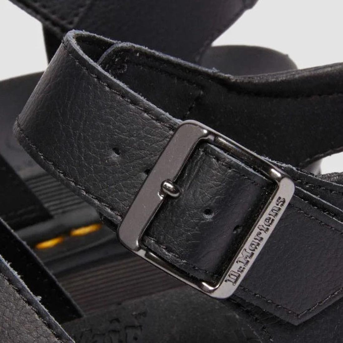 A close up of the buckle detail on a Dr Martens Blaire Anthena leather ankle strap., 190665725629,
190665725636,
190665725643,
190665725667,
190665725674,
190665725681,, 190665725629, 190665725636, 190665725643, 190665725667, 190665725674, 190665725681