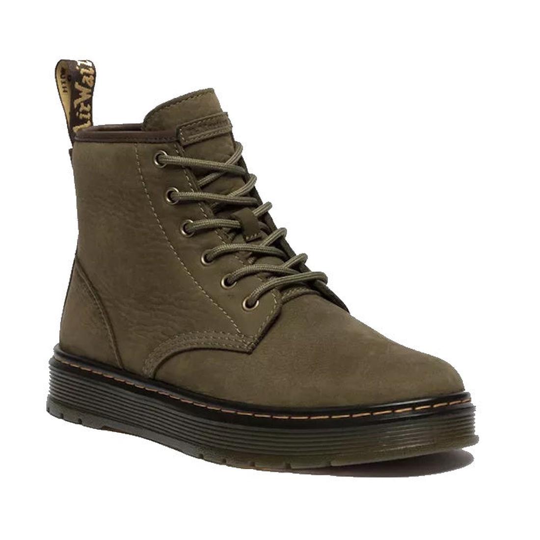 The Dr Martens Brookline Chukka Boot in olive milled nubuck leather features metal eyelets, yellow stitching, an AirWair heel loop, a thick lightweight black outsole, and a textured surface.