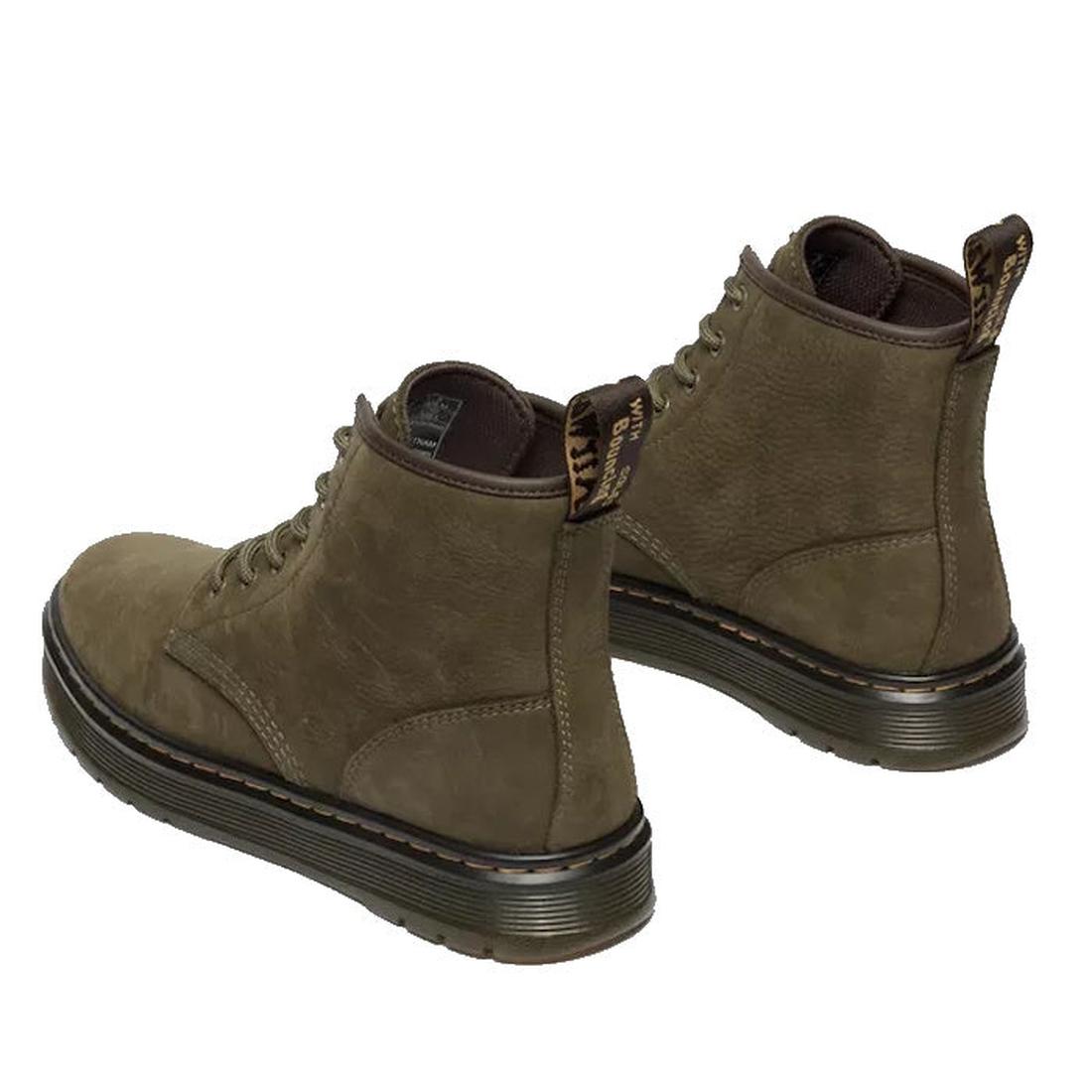 A pair of Dr Martens Brookline Chukka Boot in olive milled nubuck leather, featuring lightweight outsoles, brown soles, and yellow-text heel tabs. The boots are angled to show the back and side views., 51342, 190665797053, 190665797060, 190665797084, 1906