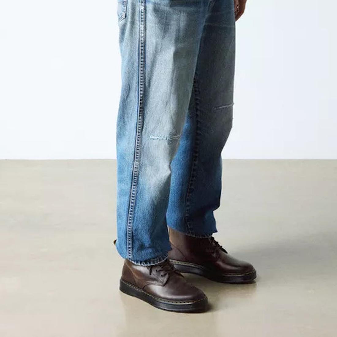 Person wearing blue jeans and brown brookline boots  on a plain background,
190665753257,
190665753264,
190665753288,
190665753295,
190665753301,
190665753325,, 45939, 190665753257, 190665753264, 190665753288, 190665753295, 190665753301, 190665753325, 459