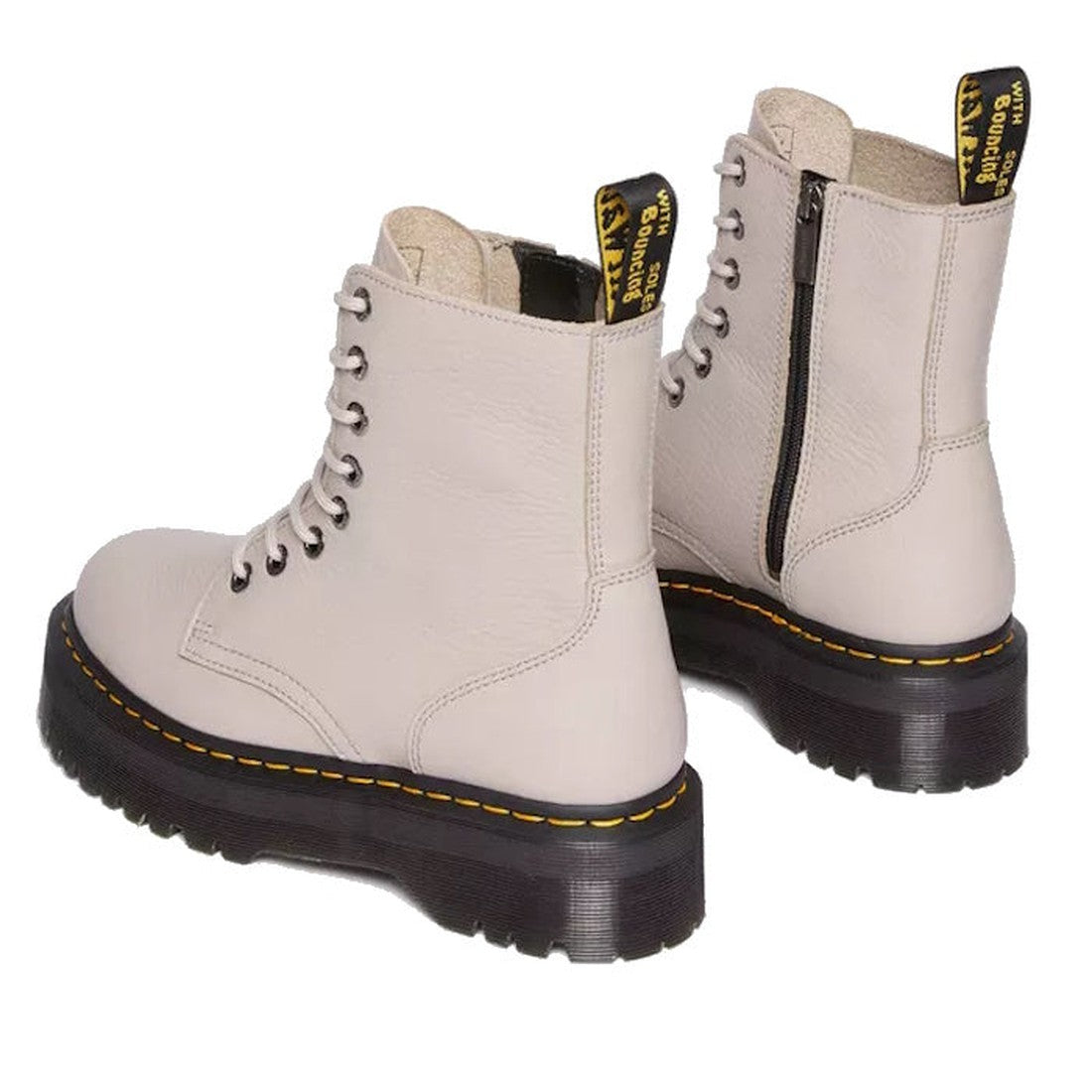 The Dr Martens Jadon III Pisa Vintage Taupe Leather Boots feature light beige milled nappa leather, lace-up fronts, thick black soles, yellow stitching, black and yellow pull tabs, side zippers, and are shown from the back and side., 190665590135, 1906655