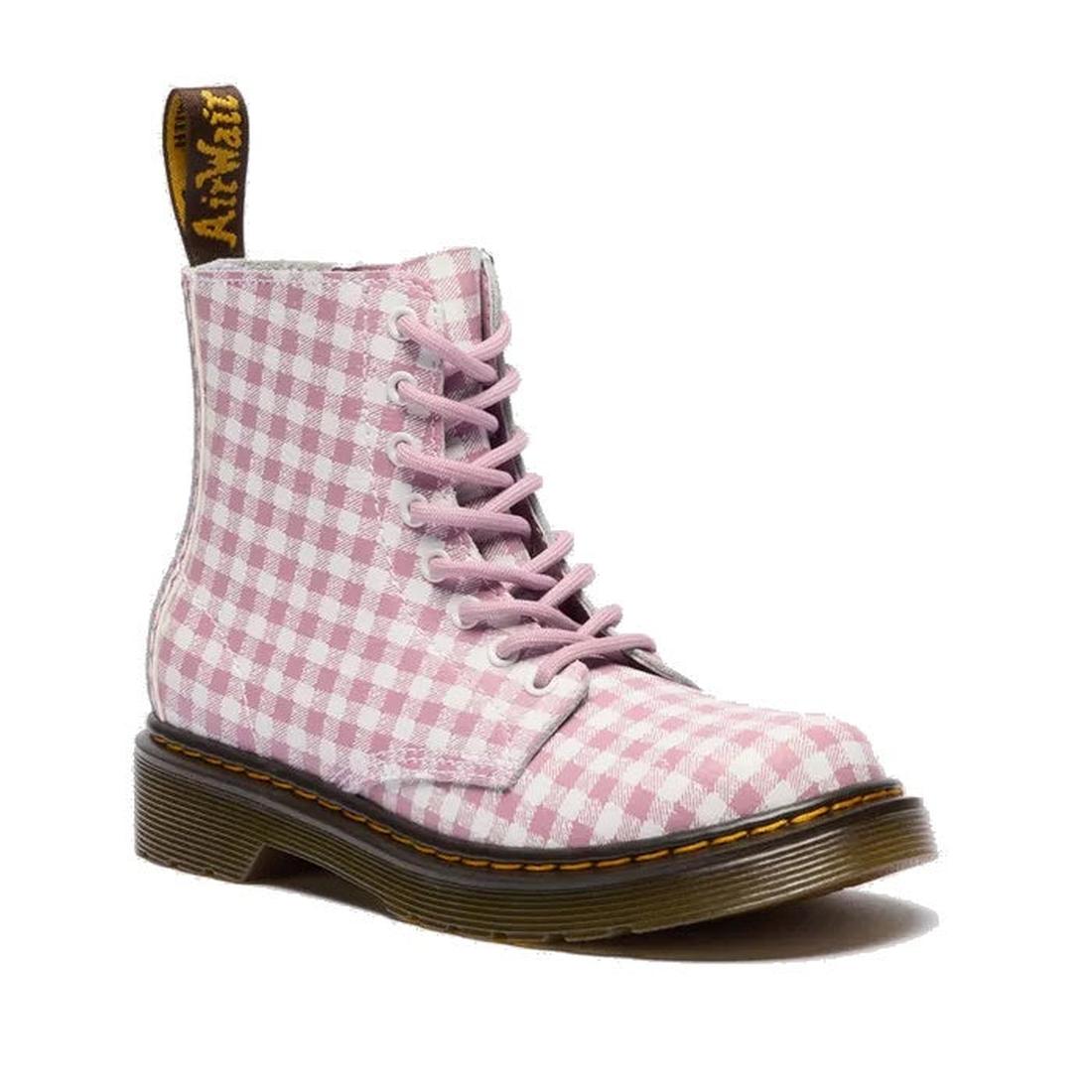 The Dr. Martens Kids 1460 J Juniors Gingham Pink Lace Up Boot features a pink gingham design with white checks, a yellow pull tab, yellow stitching around the sole, and a side zip for classic Dr. Martens style.
