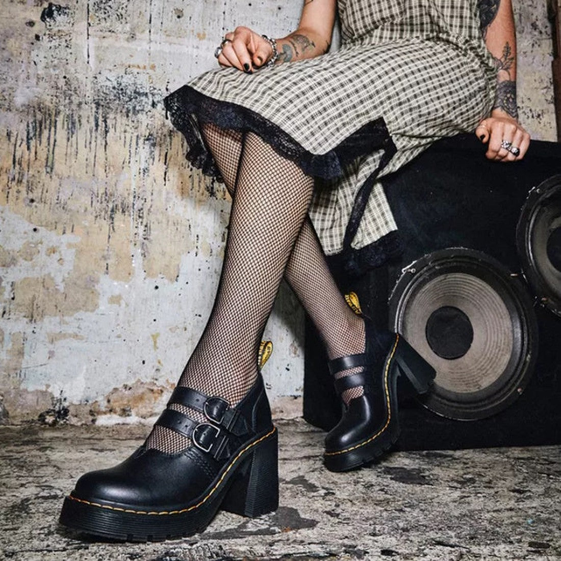 A woman in a checkered dress wears black Lottee Eviee Mary Jane shoes by Doc, with sturdy soles and buckle closures.  ksnz, 190665459623, 190665459630, 190665459647, 190665459661, 190665459678, 190665459685