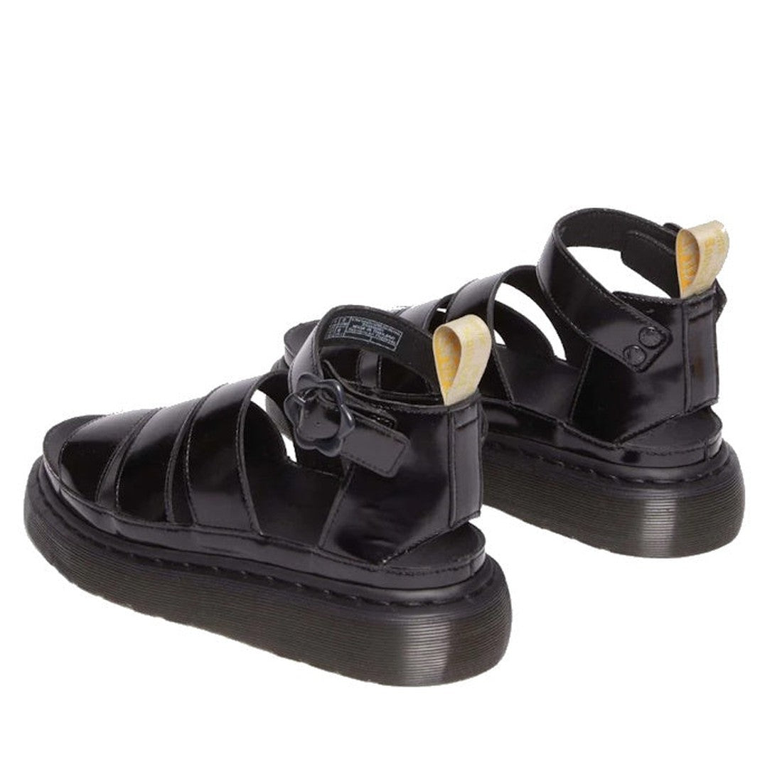 The Dr Martens V Clarissa Quad Flower Vegan Platform Sandal in Black features thick platform soles, ankle straps, and yellow pull tabs at the heels, shown against a white background., 33791, 33792, 33793, 33794, 190665594522, 190665594539, 33797, 33798