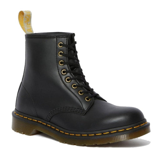 Dr Martens Vegan 1460 Black Boot: an 8-eye lace-up, durable sole, yellow stitching, and comfy heel tab—all in family-friendly vegan materials.  ksnz