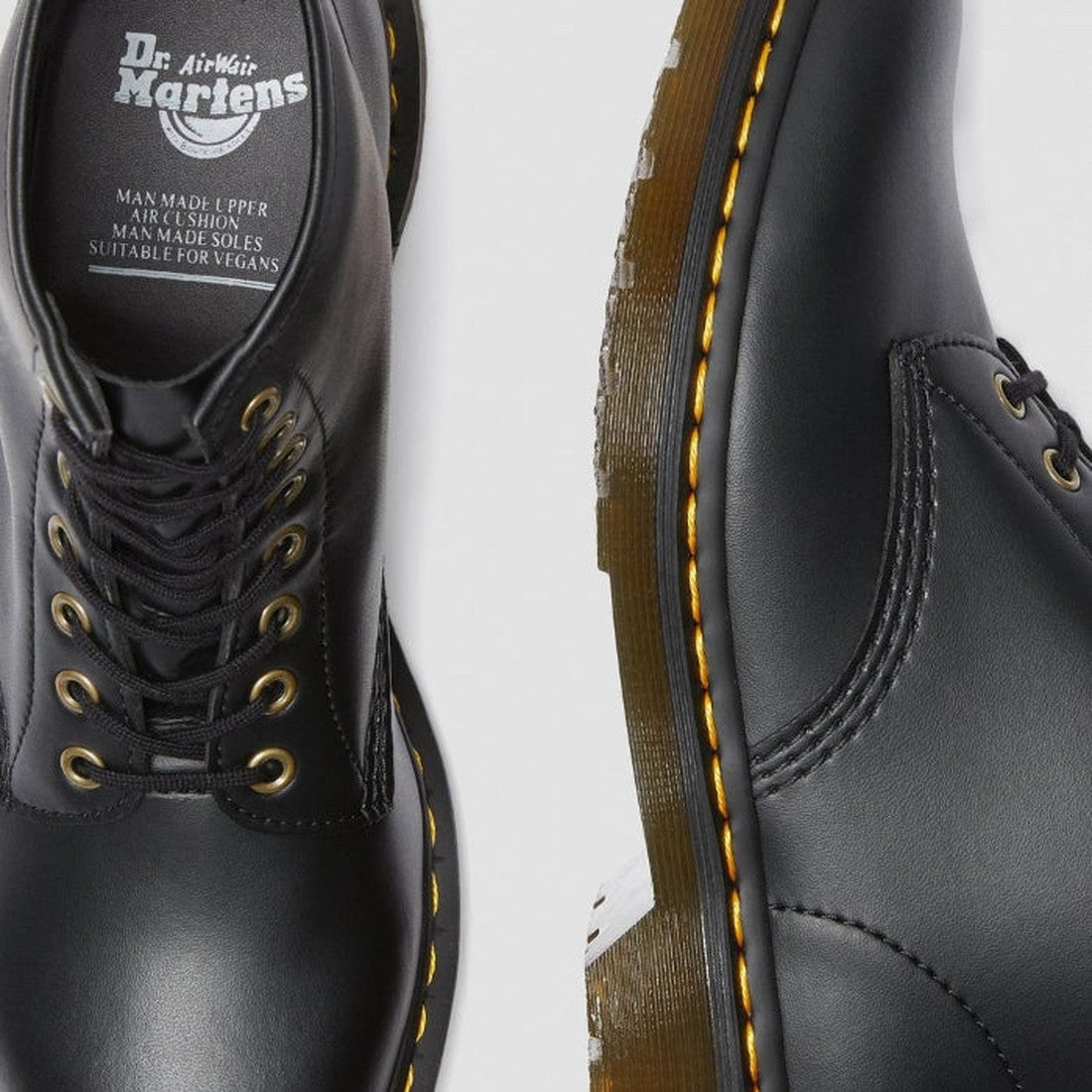 Dr Martens Vegan 1460 Black Boots, lace-up with yellow stitching, sturdy man-made sole and upper, vegan-friendly for families.  ksnz, 883985340305, 883985340312, 883985340329, 883985340336, 883985340343, 883985340350, 883985340367, 883985340374, 883985340381, 883985340398