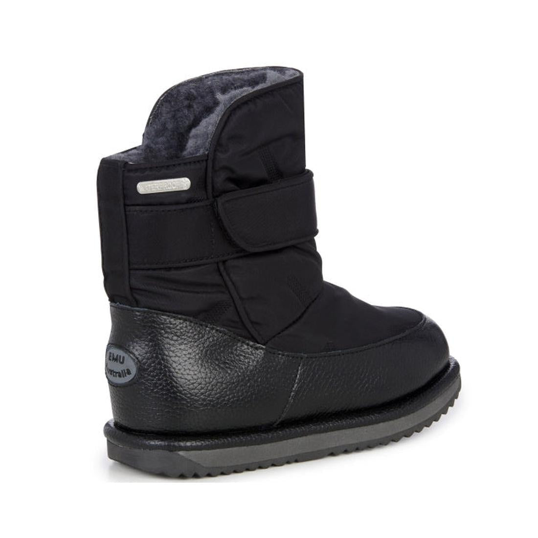 The EMU Kids Roth Black Boot is a waterproof children's boot with a textured sole, soft Australian Merino wool lining, Velcro strap, and an EMU Australia logo tag on the heel. Insulated for warmth and comfort., 9330071858516, 9330071858523, 9330071858530,