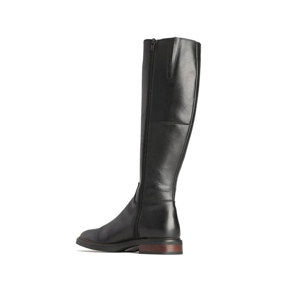 The EOS Wyoming Black High Leather Women's Heeled Boot features a tall silhouette, polished leather, side zipper, low stacked heel, and a slightly rounded toe, displayed against a white background., 9321191201733, 9321191201740, 9321191201757, 93211912017