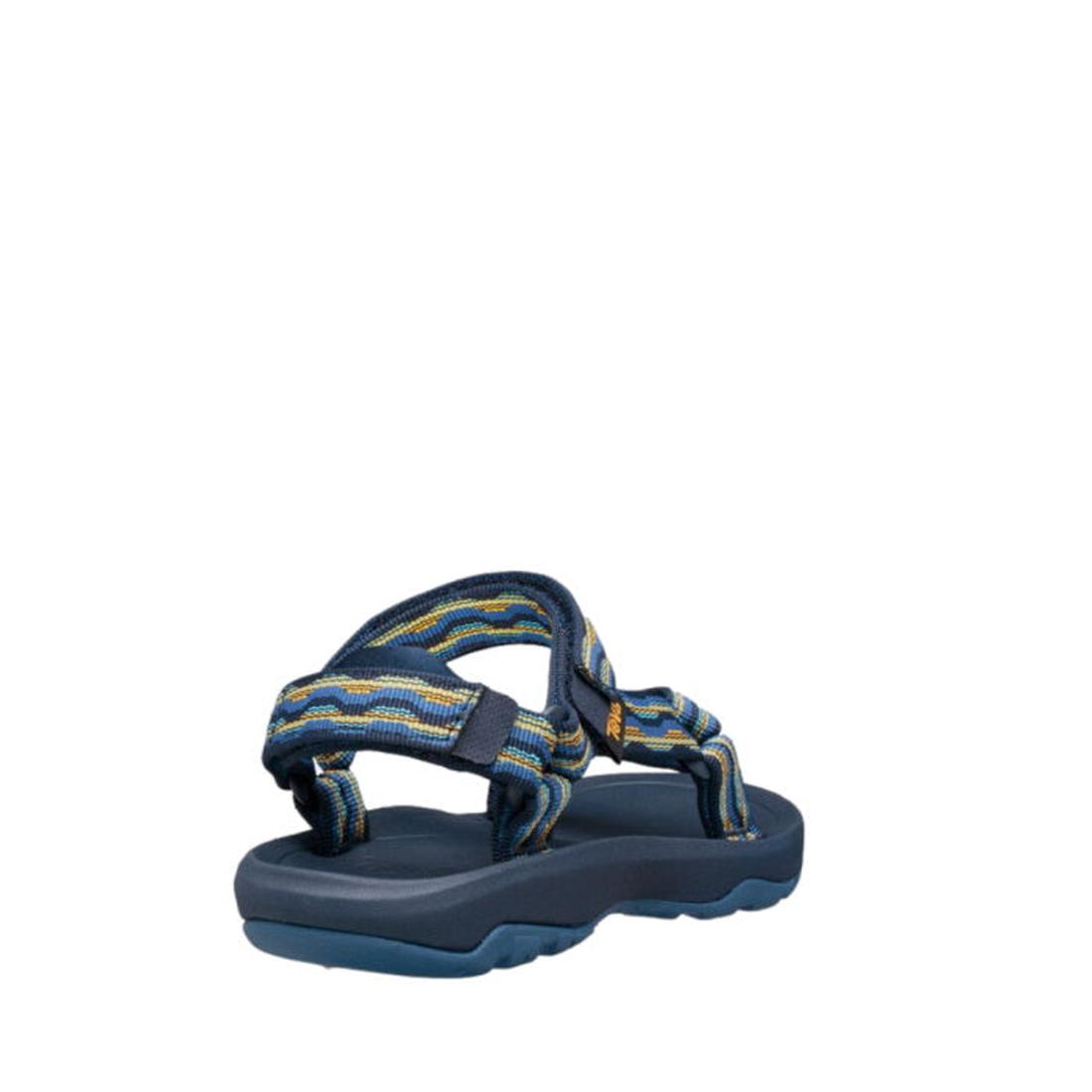 The Teva Kids K Hurricane XLT2 Kishi Dark Blue sandal, featuring a thick sole and adjustable straps, is made from recycled materials and is displayed angled from the back on a white background., 192410699667, 192410699674, 192410699681, 192410699636, 1924, 192410699643, 192410699650, 192410700707, 192410700745, 192410700752, 192410700769