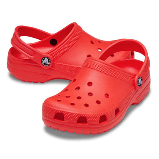 A pair of Crocs Kids Toddlers - Classic Clog Starfish Orange with ventilation holes and an adjustable heel strap, water-friendly and perfect for toddlers, placed on a white background.