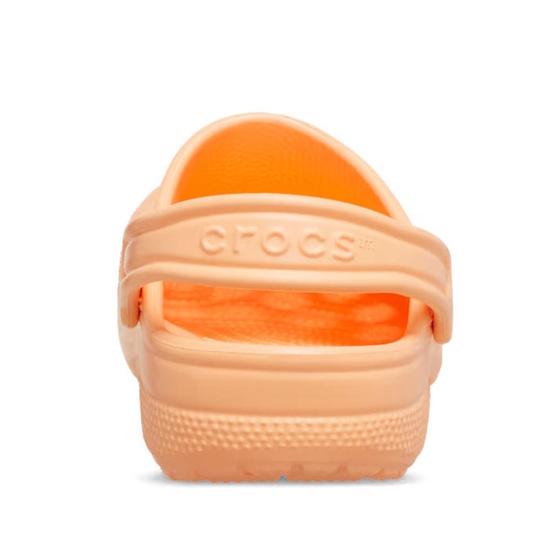 A rear view of a Crocs Kids Classic Clog in Sunstone Soft Orange (Junior Youths Sizes) shows the water-friendly heel strap with embossed Crocs logo, textured sole, and ventilated sides., 198445270154, 198445270161, 198445270178, 198445270185, 198445270192