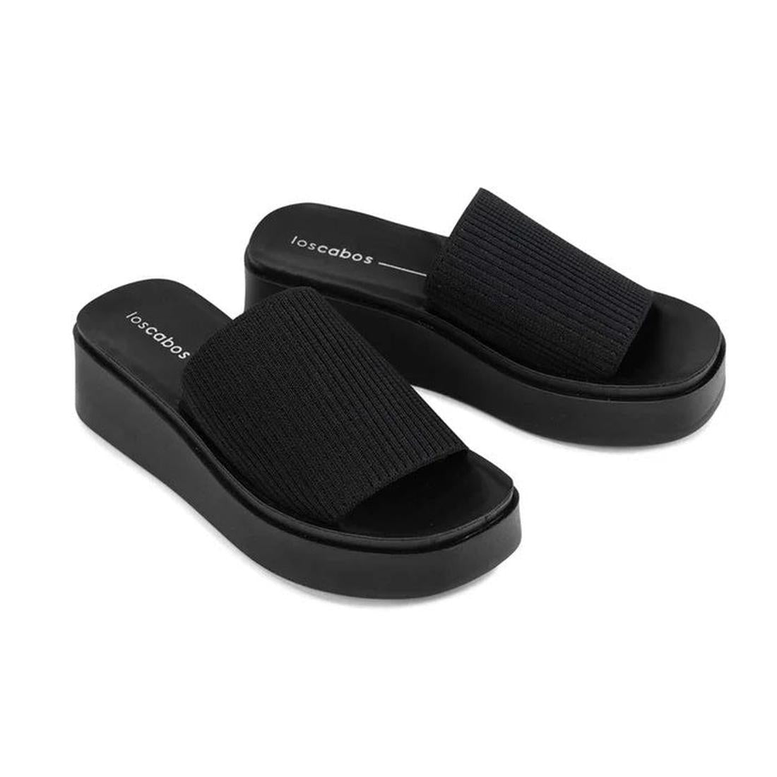 The Los Cabos Pass Women's Wedge Heeled Slide Sandal in Black features flatform soles, textured wide straps, a padded insole for comfort, and visible Los Cabos branding on the footbed, shown on a white background., 9321191228464, 9321191228471, 9321191228