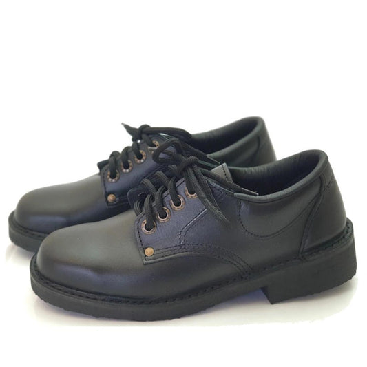 The McKinlays Black Lace Up School Shoe Jill is a pair of black leather lace-up shoes with thick soles and grey stitching, shown on a white background and available in US women's sizes.