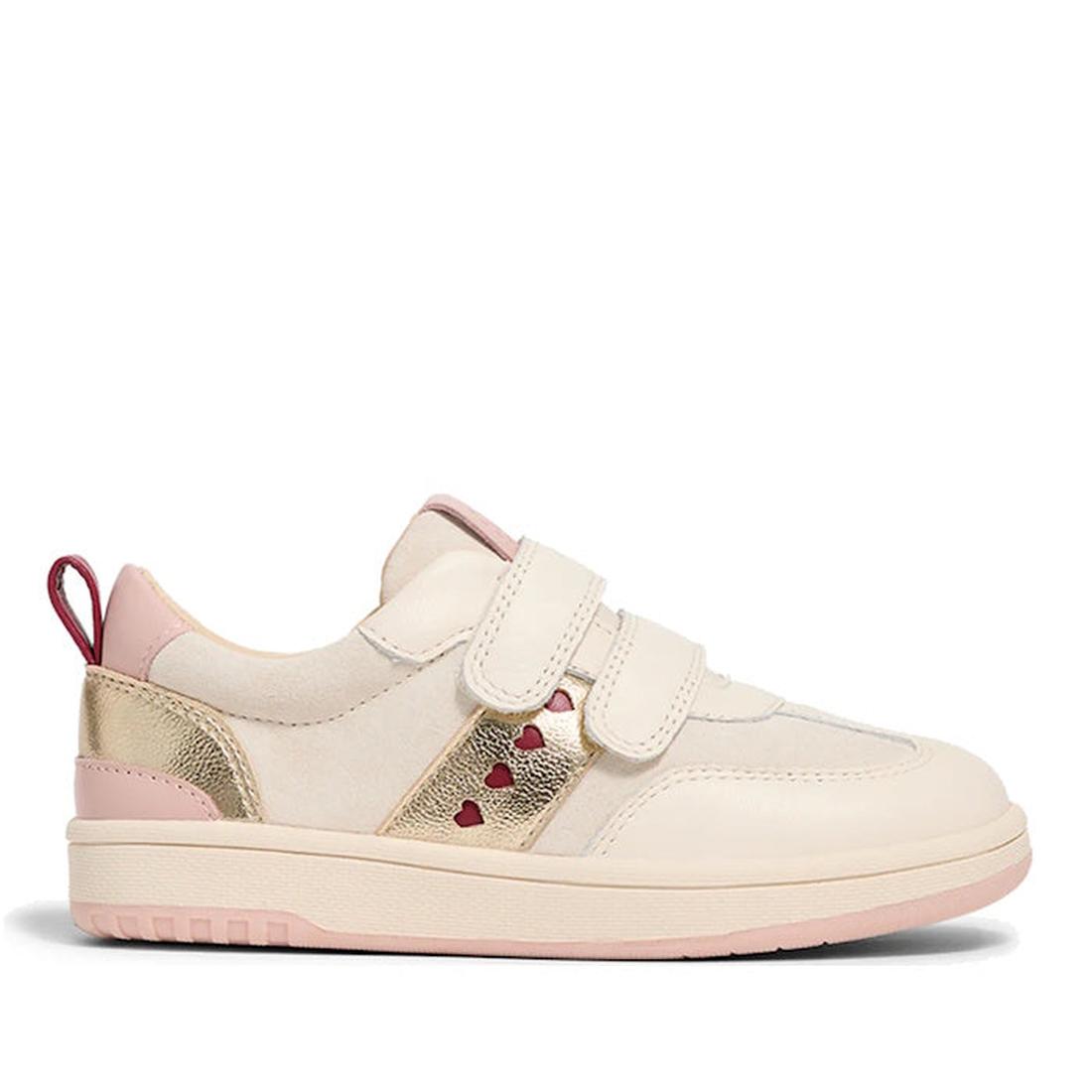 The Pretty Brave River Hearts Leather Trainer Pink Off White is a kids' sporty sneaker in cream genuine leather, featuring pink accents, gold detailing on the heel and strap, two Velcro straps, small red heart cutouts, a pink pull tab, and a light pink so