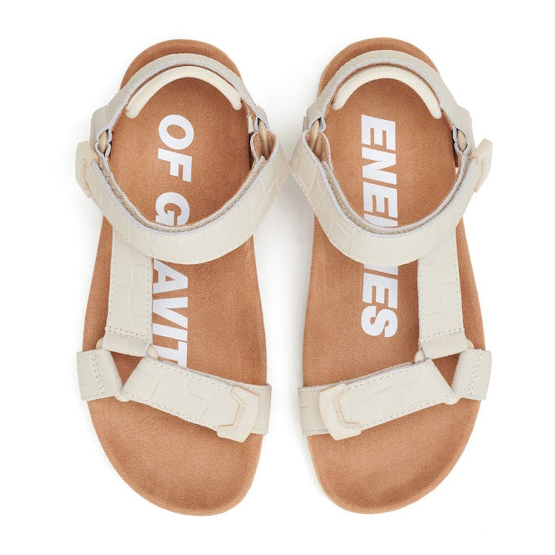 The Rollie Womens Sandal Tooth Wedge Bone Croc features beige sheep leather adjustable straps, brown insoles with “ENEMIES OF GRAVITY” across both shoes, and a comfy suede-wrapped footbed for all-day support., 9781760775865, 9781760775872, 9781760775889, 