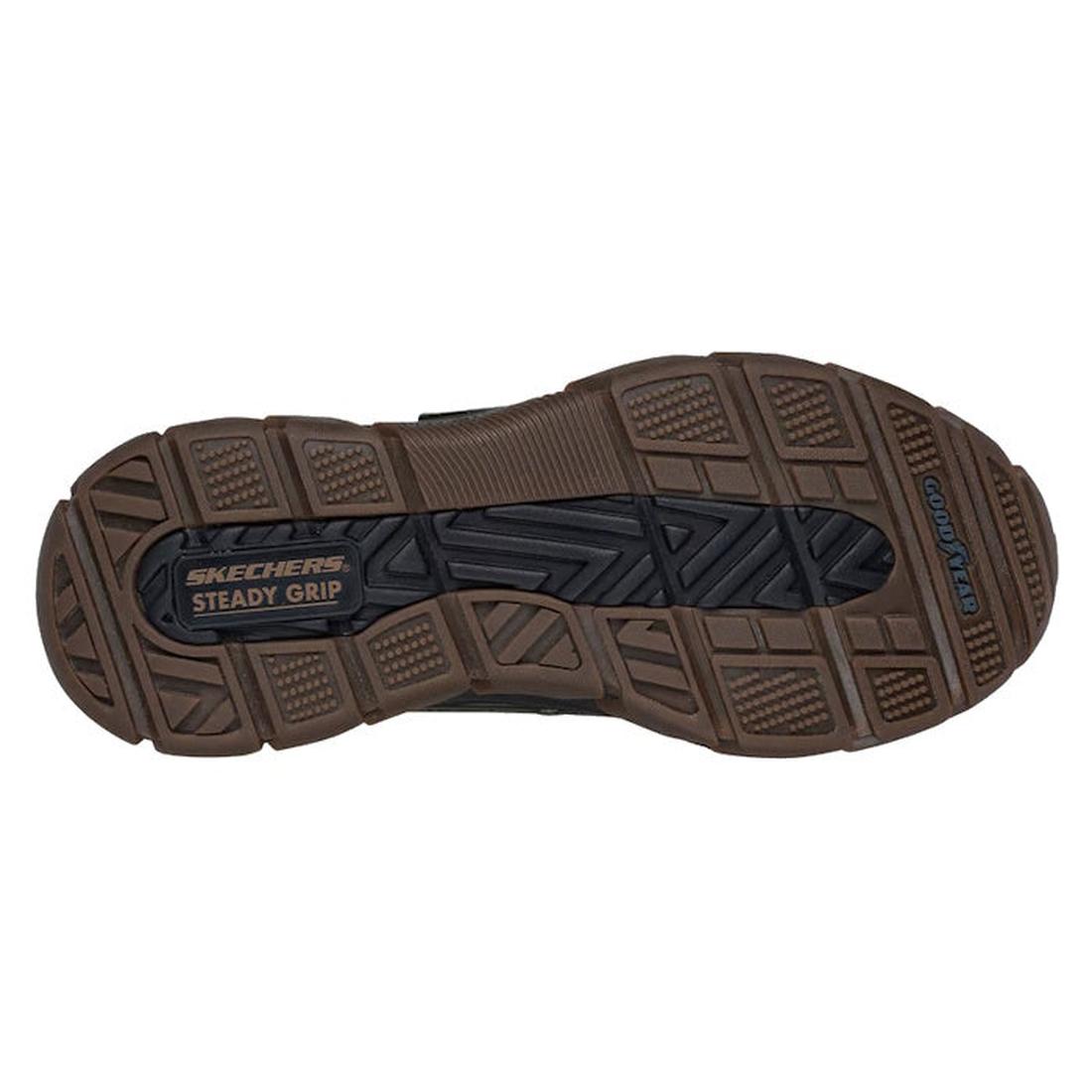 The image shows the brown and black treaded sole of Skechers John Deere Waterproof Respected Swamper Boots Olive Brown Slip Ins, labeled SKECHERS STEADY GRIP and GOODYEAR, highlighting a durable, slip-resistant design., 50410, 198376036836, 198376036850, 