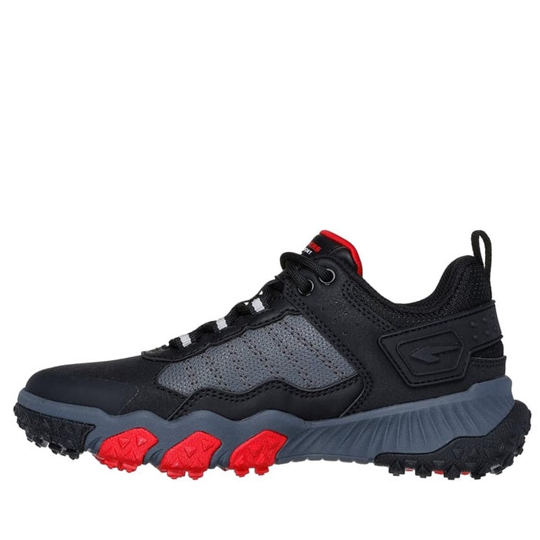 The Skechers Boys Elite Sport Field in black and grey with mini sprigs features a rugged sole, cushioned insole, red-accented outsole, mesh side panels, black laces, and a pull tab—ideal multi-field athletic shoes for outdoor or trail use., 44806, 44807, 