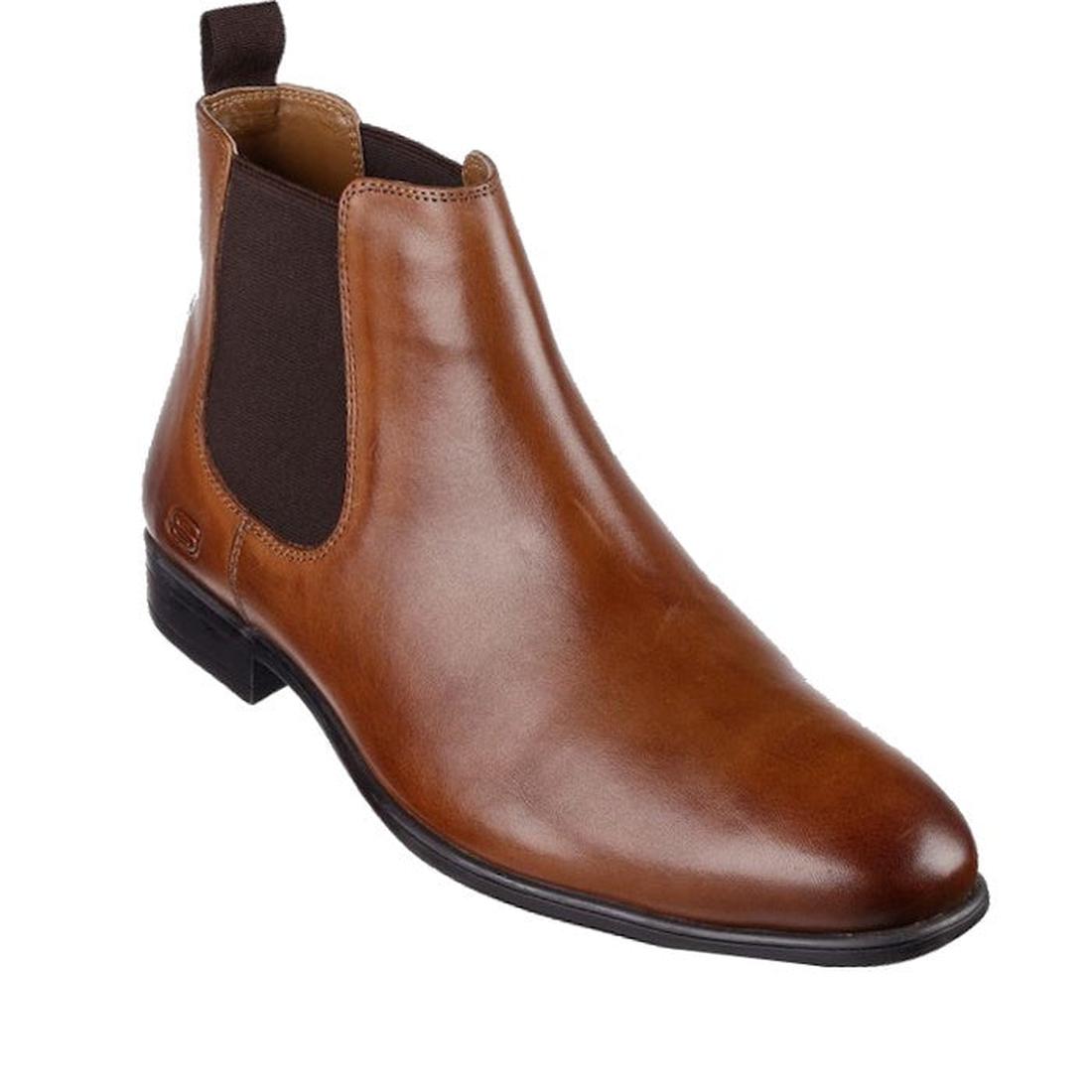 The Skechers Mens Trentmore Heights Cognac Brown Leather Pull On Boots is a brown Chelsea boot with a rounded toe, black sole, dark brown elastic side panels, back pull tab, smooth finish, and Air-Cooled Memory Foam for comfort.