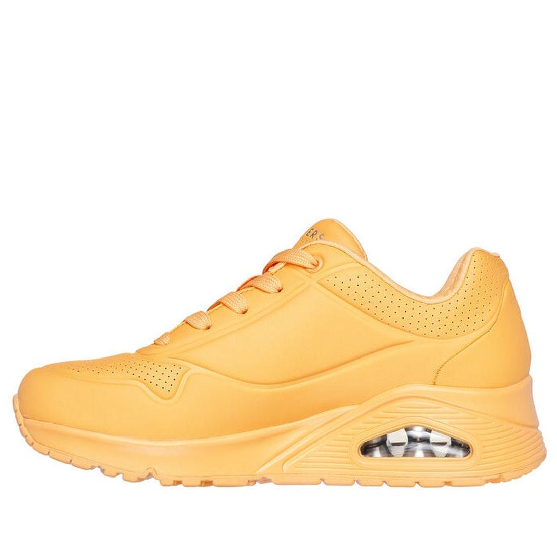 A side view of the Skechers Uno Stand On Air Womens Trainer in orange, featuring visible air-cushion sole, orange laces, perforated ankle for ventilation, and Air-Cooled Memory Foam for comfort., 42039, 42040, 193642531305, 42042, 193642531329, 42044, 193