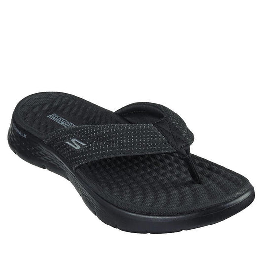 The Skechers Go Walk Flex Sandal Impress Slide Black features a textured sole, memory foam footbed, and a mesh fabric strap with the Skechers S logo on the side.