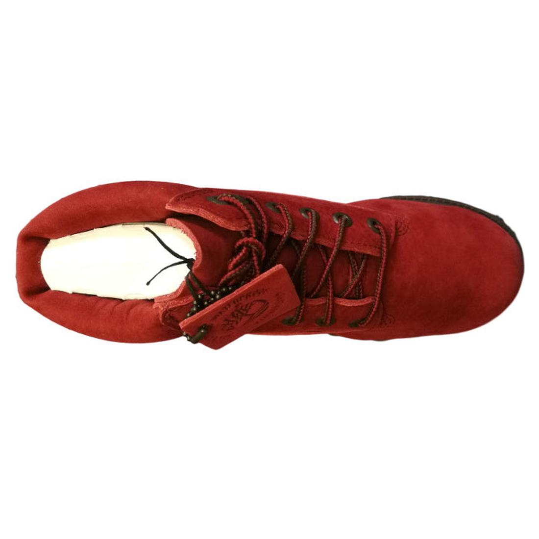 Dark red suede boot with laces and a hanging tag, viewed from above.