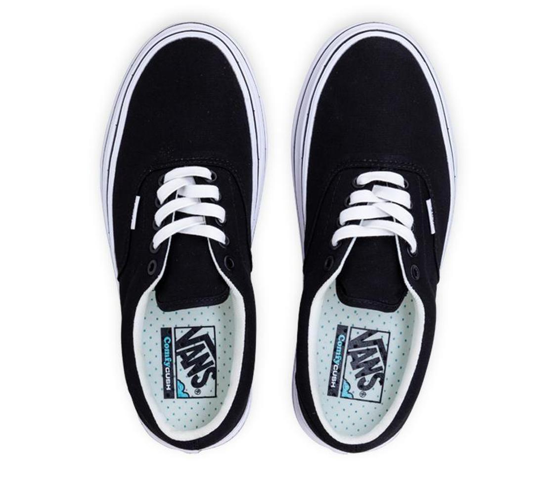Vans Super Comfycush ERA sneakers in classic black, lace-up style for adults, with comfy white soles and fun blue polka dot insoles.  ksnz