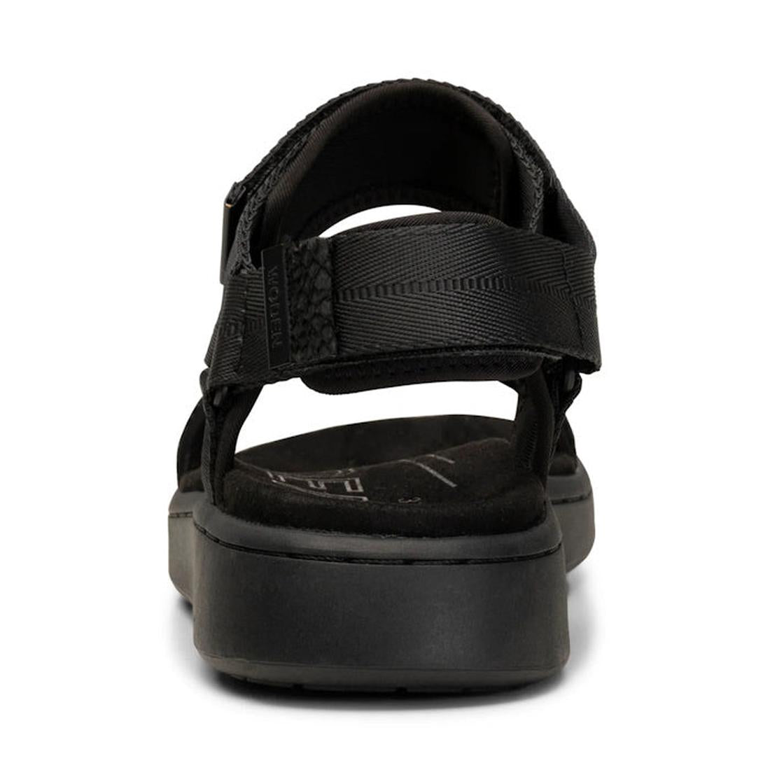 A close-up rear view of the Woden Line Women's 3 Strap Sandal Black, featuring adjustable straps, a thick cushioned sole, and Natural Soft technology at the heel and part of the footbed for enhanced comfort., 5713326456912, 5713326456929, 5713326456936, 5