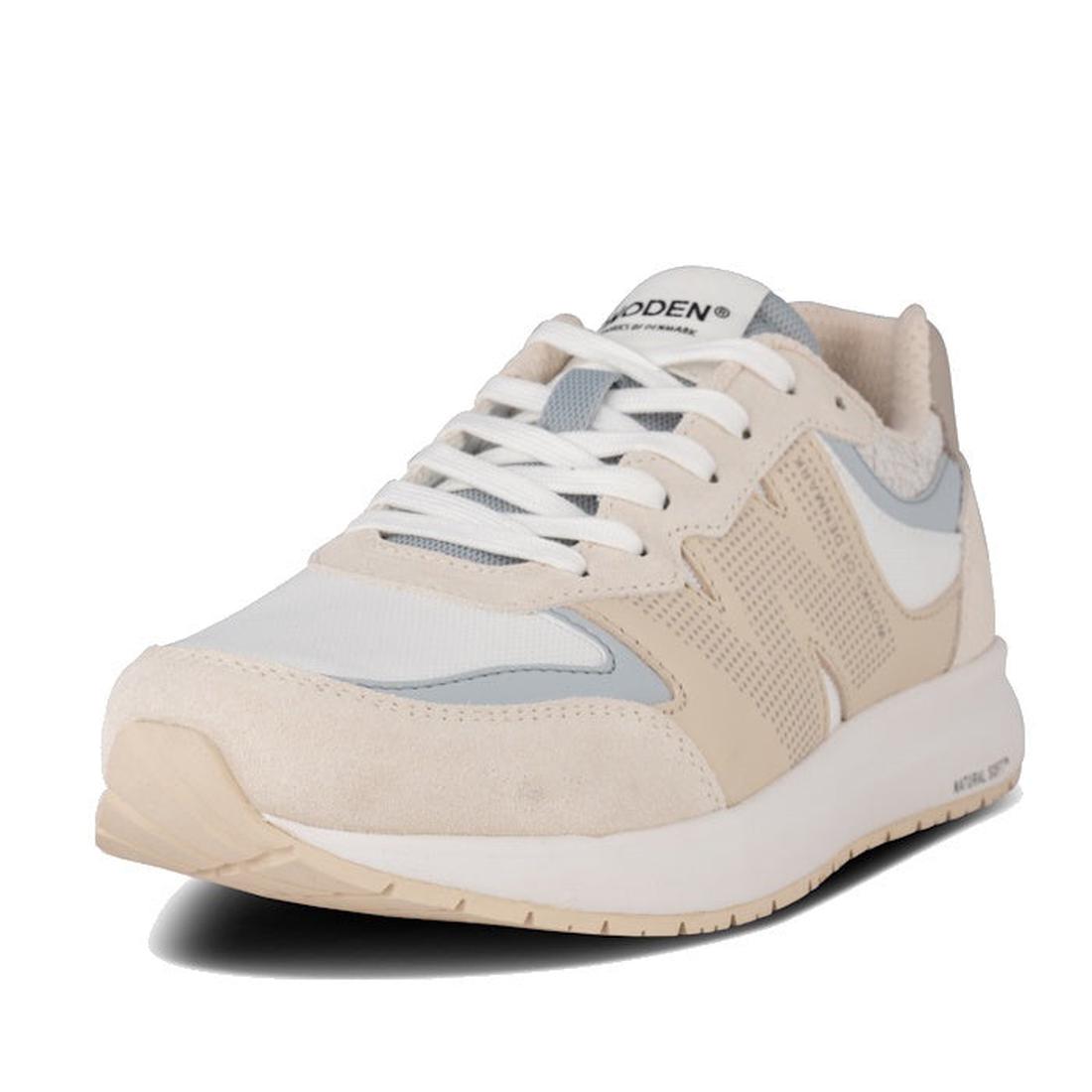 The Woden Rigmor Reflective Women's Sneaker in Ivory is a cream and white athletic shoe with white laces, beige sole, light gray accents, a branded tongue label, crafted from recycled materials, shown angled on a plain white background.
