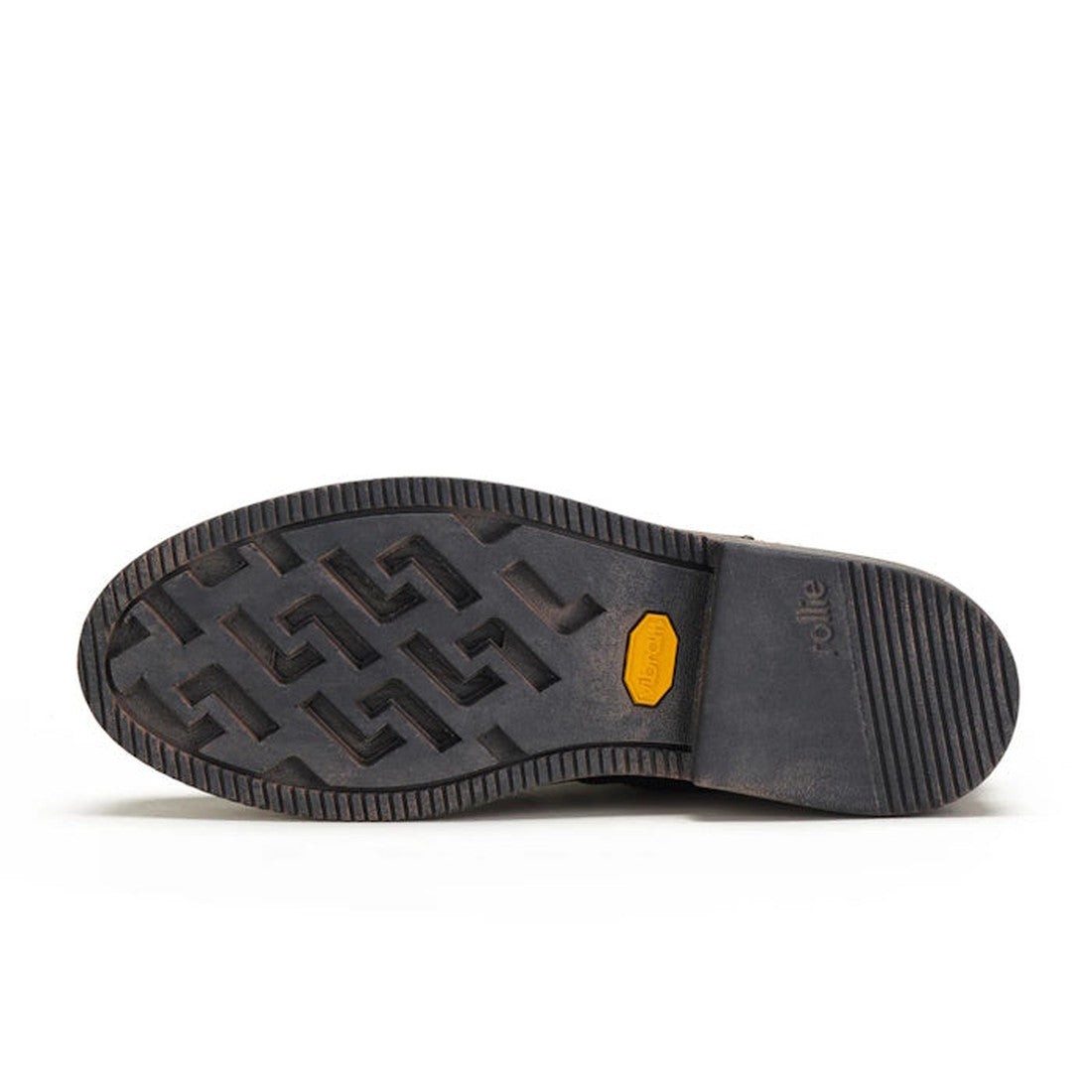 The image shows the bottom view of the Rollie Womens Ankle Black Leather Boot Side Zip Rise Artisan, featuring a patterned Vibram outsole with a yellow hexagonal logo at the center and horizontal grooves on the heel for extra grip., 9339554339214, 9339554