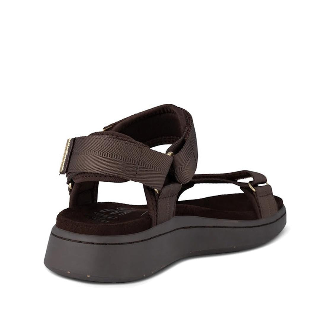 The Woden Line Women's 3 Strap Sandal in Chocolate Brown offers comfort with adjustable straps, a cushioned sole featuring Natural Soft technology, visible stitching, and a thick sole. Shown from a back angled side view., 48196, 5713326592511, 57133265925