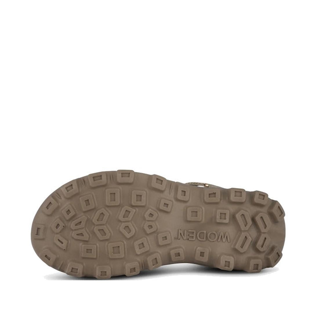 The image shows the bottom view of a Woden Sandie Women's Chunky Sandal Stone sole, made from durable materials with a rugged, multi-shaped tread and "MODERN" embossed in the center., 48636, 5713326607703, 5713326607710, 5713326607727, 5713326607734, 5713