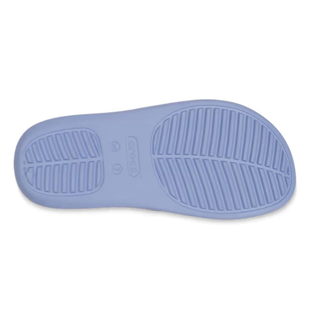 The image displays the light blue rubber sole of the Crocs - Womens Getaway PLATFORM Flip Sandal Blue Haze, featuring Free Feel Technology and two tread patterns: horizontal grooves on the left and diagonal grooves on the right., 49903, 49904, 19844527424