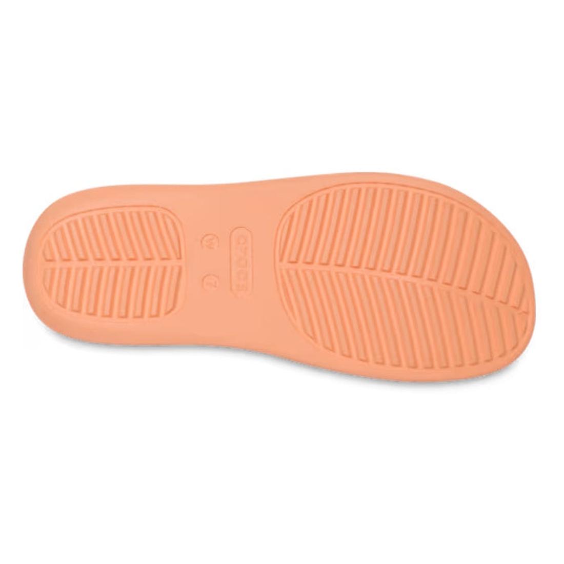 The image shows the sole of the Crocs - Womens Getaway PLATFORM Flip Sandal in Sunstone Orange, highlighting two tread patterns, Free Feel Technology, and the Crocs brand name embossed at the center., 49910, 49911, 198445274329, 198445274336, 198445274343