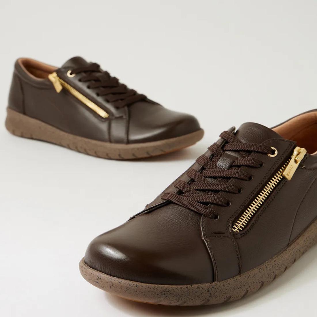 The Ziera Solar XW Women's Casual Sneaker features chocolate brown leather, brown laces, side gold zippers, and textured rubber soles, displayed against a plain light background., 51019, 44347555285581, 4434755525604, 4434755525628, 4434755525642, 4434755